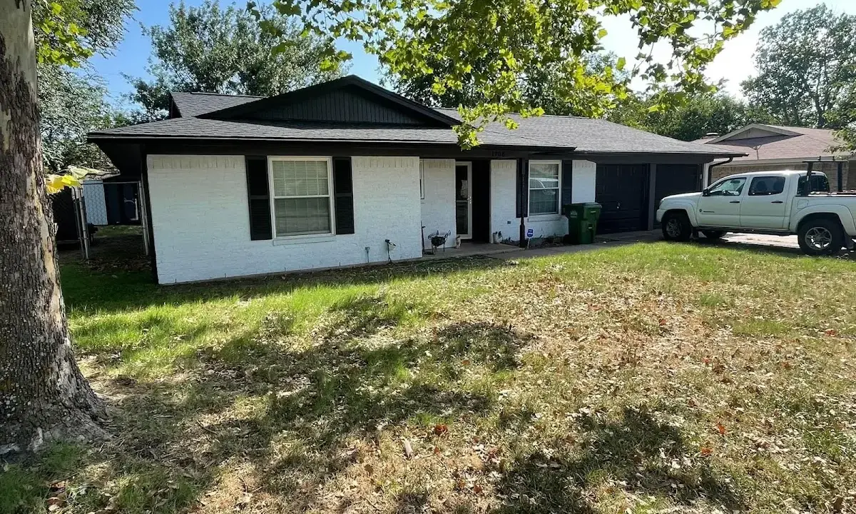 Professional roofing crew working on a residential roof in Plaistow